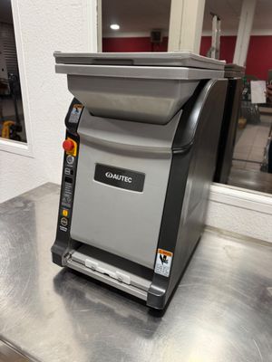 a machine that is sitting on a table in the kitchen