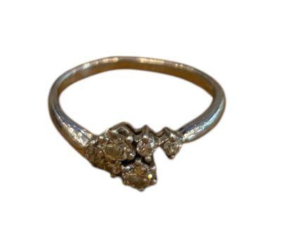 an image of a gold ring with two skulls on it