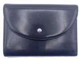 a black leather wallet with a metal button on the front