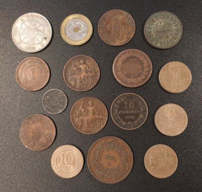 many different types of coins on the table