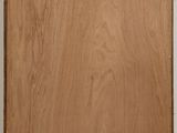wooden cutting board on a white counter top with a white background