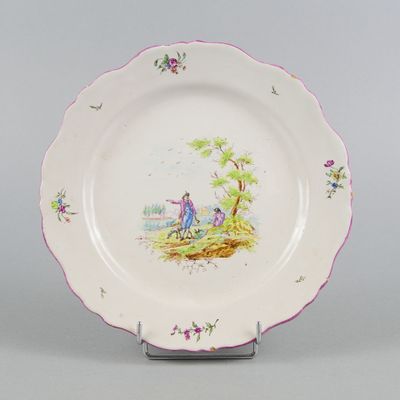 a plate with a picture of a man and a woman on it