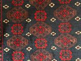 a rug with a red and black design on it