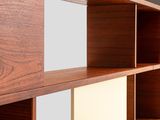 a wooden shelf with a mirror on it in a room