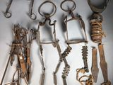 a lot of old tools that are laying on a table