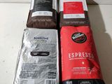 three bags of coffee sitting on top of a counter next to each other