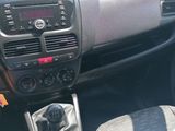 a dashboard of a small car with a steering control