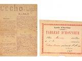 un vieux document bordé de rouge et un bout de papier sur lequel il y a des inscriptions