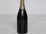 a bottle of champagne sitting on a marble table