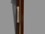 a grandfather clock that is hanging on the wall