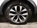 a close up of a tire on a white car
