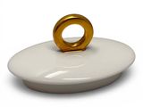 a white plate with a gold ring on it