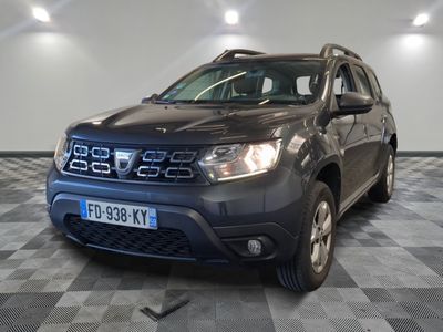 a picture of a grey dacia parked in a showroom