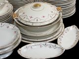 a lot of plates and bowls that are stacked together