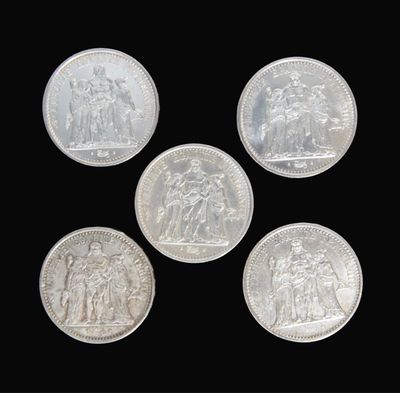 four silver coins with a picture of a man and a woman on them