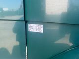 a sticker on the side of a green truck