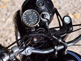 a close up view of a motorcycle handlebars and gauges