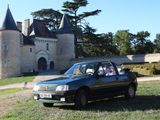 a car that is parked in front of a castle