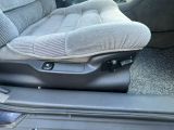 a seat in the back of a car with a seat cushion on it
