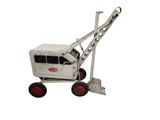 a toy tractor with a ladder attached to it ' s back