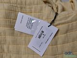 a label on a shirt that is hanging on a hanger