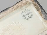 a close up of a vase with a label on it