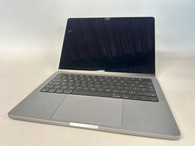 an open laptop computer sitting on top of a white table