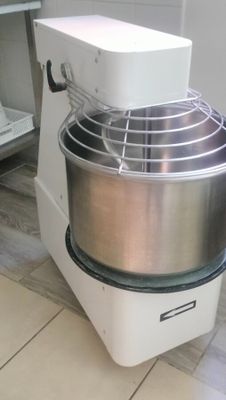 an image of a mixer on the floor in a kitchen