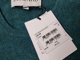 a picture of a blue sweater with a barcode on it