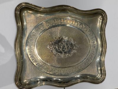 a silver tray with a picture of a horse on it