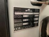 a sign on the side of a machine that says still