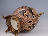 a decorative egg that is sitting on top of a table