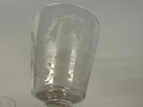 a glass that is sitting on top of a table