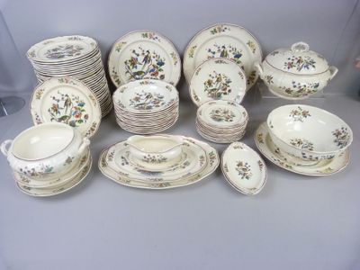 many different types of china dishes and cups on the table