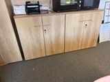 a microwave sitting on top of a cabinet in a room