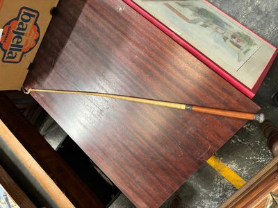 a wooden table with a wooden stick on top of it