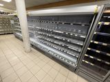 many empty refrigerators in a store that are on display