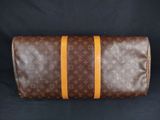 a louis vuittou toilet bag on a black background