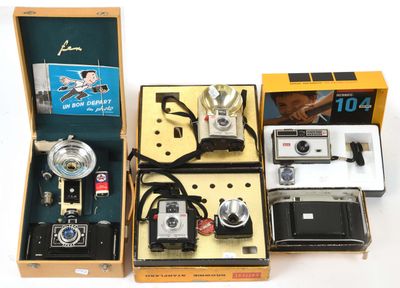 a lot of different types of cameras in a box