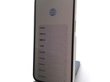 an image of a cell phone sitting on top of a metal stand