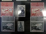 several different stamps on display in a display case on a table