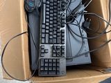 a box with a keyboard and a mouse inside of it