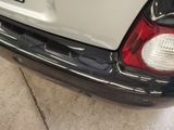 a close up of a car ' s tail light on the back of the car