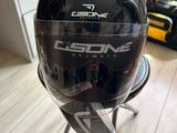 a helmet sitting on a chair in a room