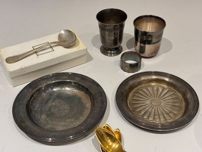 a lot of silverware on a table with a box
