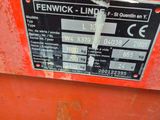 the back of a red machine with a label on it ' s side
