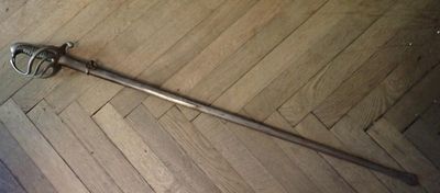 a sword that is laying on the floor on the floor