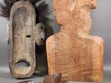 two pieces of wood and a wooden object on a table