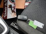 a car key with a tag on it sitting in a car seat