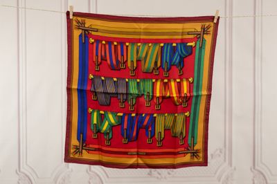 a colorful scarf hanging on a clothes line in a room